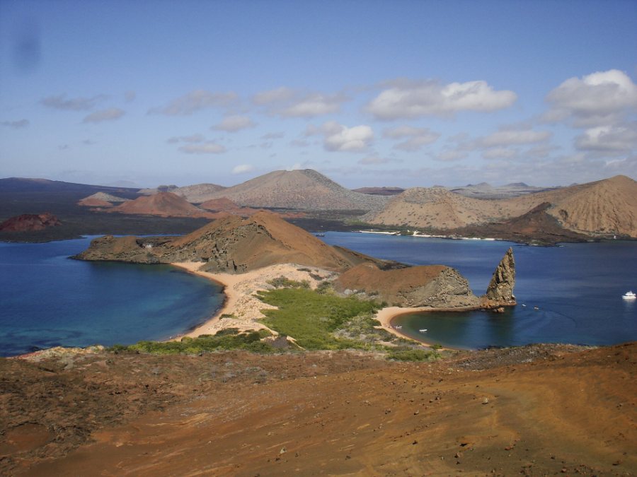 Volcanic islets, bays and Pinnacle Rock seen from Bartolome Island in the Galapagos